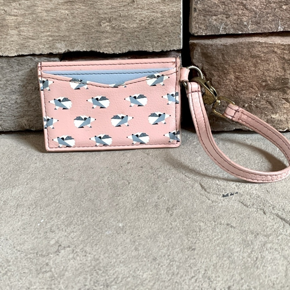 Fossil pink and blue card holder wristlet with hedgehog design